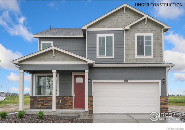 1639 Pinnacle Ave, Lochbuie, CO 80603 - craftsman house with covered porch, a garage, driveway, and stone siding