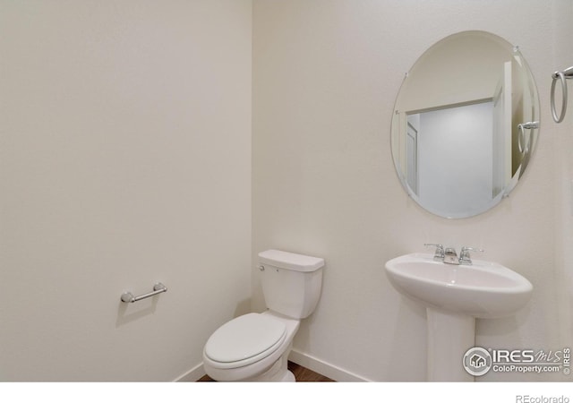 1639 Pinnacle Ave, Lochbuie, CO 80603 - bathroom featuring toilet and wood finished floors