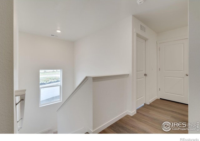 1639 Pinnacle Ave, Lochbuie, CO 80603 - hallway featuring an upstairs landing, wood finished floors, and recessed lighting