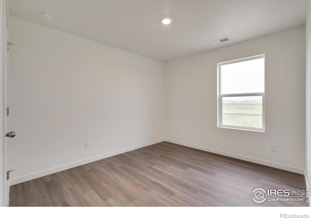 1639 Pinnacle Ave, Lochbuie, CO 80603 - empty room featuring wood finished floors and a smoke detector