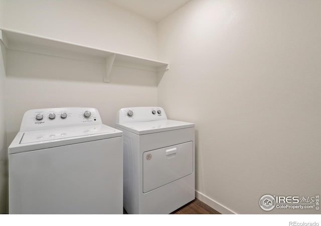 1639 Pinnacle Ave, Lochbuie, CO 80603 - laundry area with washing machine and dryer and dark wood-style floors