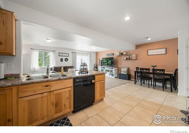 3145 Alybar Dr # 16B, Wellington, CO 80549 - kitchen with black dishwasher, open floor plan, light tile patterned floors, a peninsula, and dark countertops