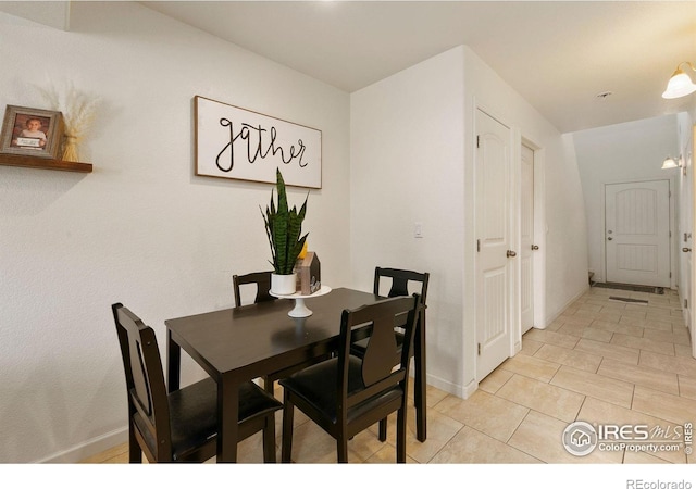 3145 Alybar Dr # 16B, Wellington, CO 80549 - dining space featuring baseboards and light tile patterned floors