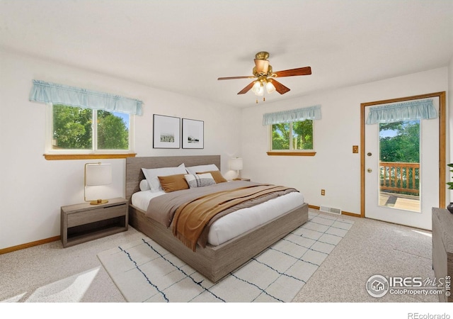 4222 W 22nd Street Rd, Greeley, CO 80634 - carpeted bedroom with access to outside and a ceiling fan
