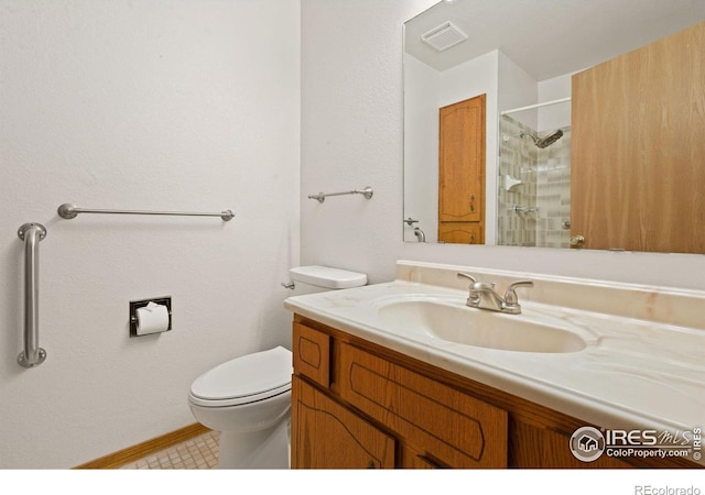 4222 W 22nd Street Rd, Greeley, CO 80634 - full bathroom featuring vanity, a shower, and tile patterned flooring