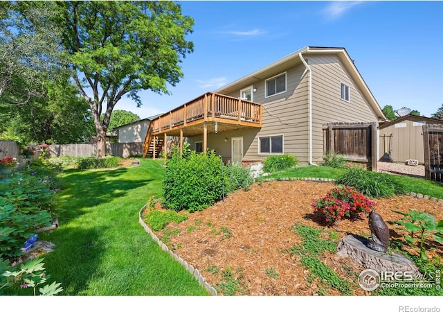 4222 W 22nd Street Rd, Greeley, CO 80634 - back of property featuring stairway, a wooden deck, and a storage shed