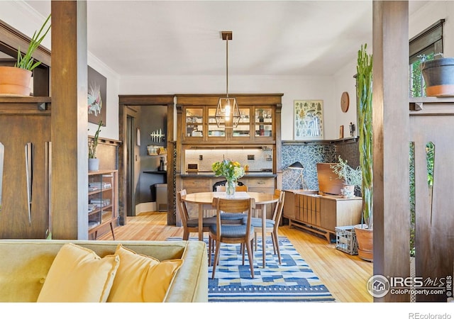 1217 N Downing St Unit 4, Denver, CO 80218 - dining room featuring light wood-style flooring and ornamental molding