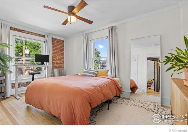 1217 N Downing St Unit 4, Denver, CO 80218 - bedroom with multiple windows, crown molding, light wood-style flooring, and ceiling fan
