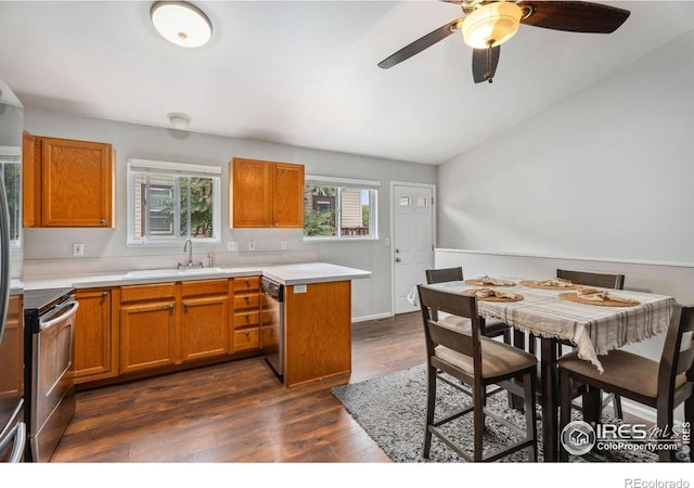 1144-1148 E 5th St, Loveland, CO 80537 - kitchen featuring stainless steel appliances, dark wood-type flooring, brown cabinetry, and ceiling fan