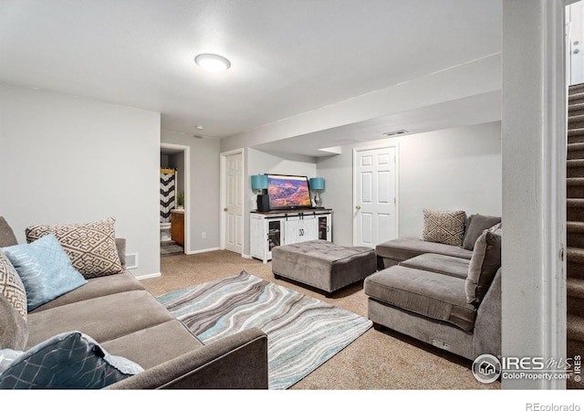 1144-1148 E 5th St, Loveland, CO 80537 - carpeted living room featuring stairway and bar