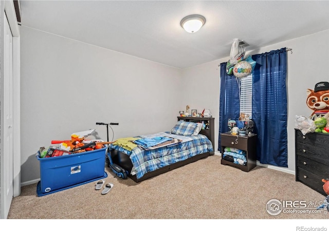 1144-1148 E 5th St, Loveland, CO 80537 - carpeted bedroom featuring baseboards