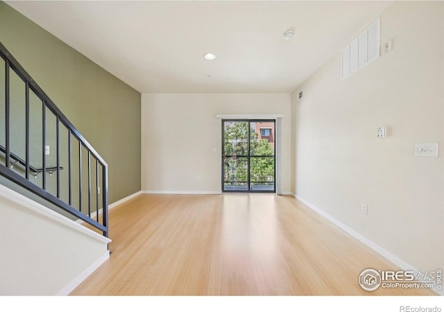 1200 Yarmouth Ave Unit 237, Boulder, CO 80304 - empty room with wood finished floors, stairs, and recessed lighting