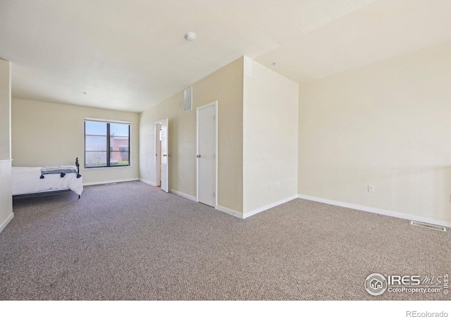 1200 Yarmouth Ave Unit 237, Boulder, CO 80304 - carpeted empty room featuring baseboards