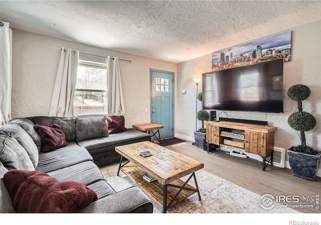 4009 W 52nd Ave, Denver, CO 80212 - living room featuring a textured ceiling, wood finished floors, and a textured wall