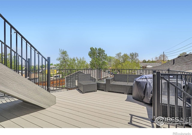 4009 W 52nd Ave, Denver, CO 80212 - wooden deck with stairway and outdoor lounge area