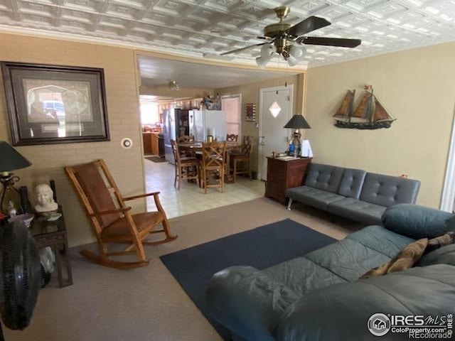 205-207 W 3rd Ave, Wiggins, CO 80654 - living area with an ornate ceiling and a ceiling fan