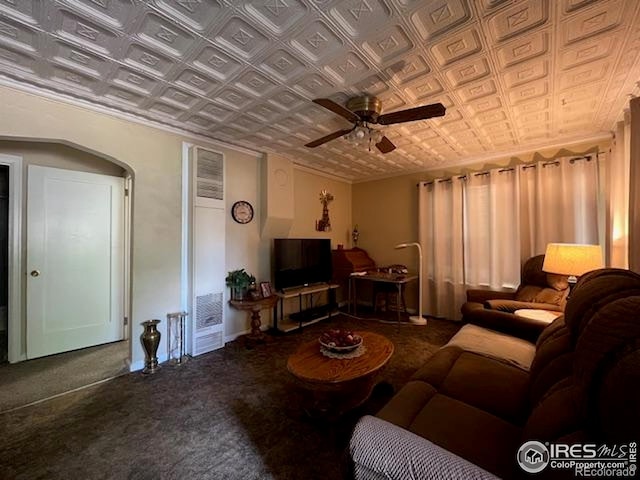 205-207 W 3rd Ave, Wiggins, CO 80654 - carpeted living room featuring an ornate ceiling and a ceiling fan