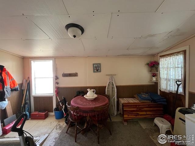 205-207 W 3rd Ave, Wiggins, CO 80654 - dining room with wood walls and wainscoting