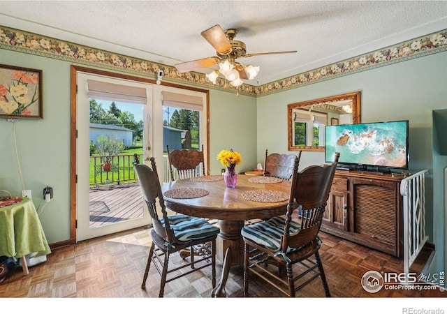 8840 Niwot Rd, Niwot, CO 80503 - dining space featuring healthy amount of natural light, a ceiling fan, and a textured ceiling
