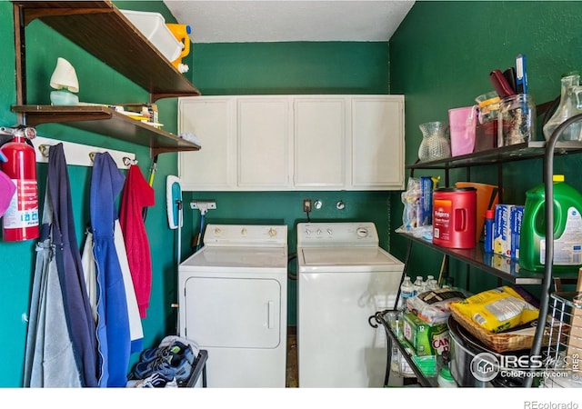 8840 Niwot Rd, Niwot, CO 80503 - laundry area featuring separate washer and dryer and cabinet space