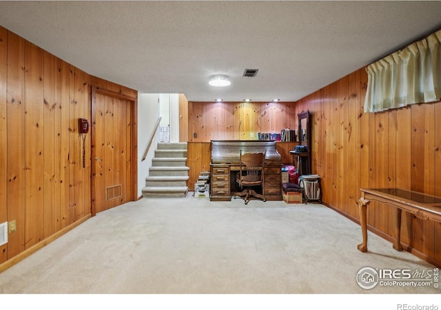 8840 Niwot Rd, Niwot, CO 80503 - home office featuring carpet, wood walls, and a textured ceiling