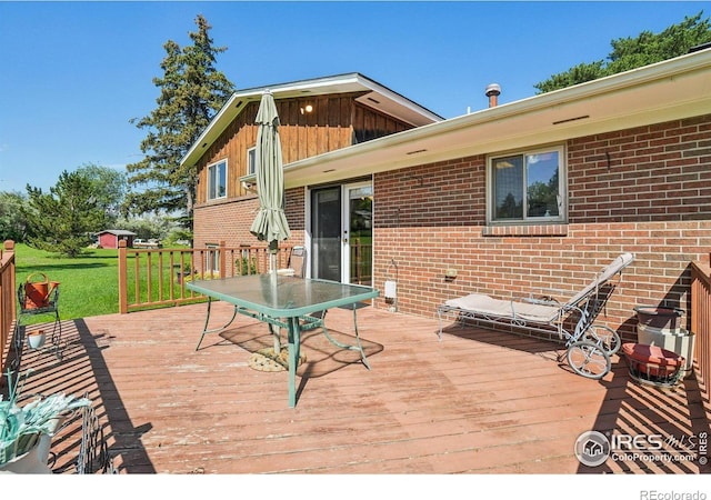 8840 Niwot Rd, Niwot, CO 80503 - wooden deck featuring a lawn