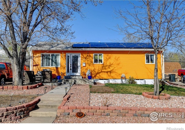 7970 Wolff Ct, Westminster, CO 80030 - view of front of home featuring roof mounted solar panels and entry steps