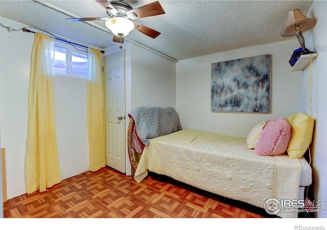 7970 Wolff Ct, Westminster, CO 80030 - bedroom featuring a textured ceiling and ceiling fan