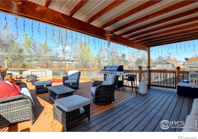7970 Wolff Ct, Westminster, CO 80030 - wooden terrace with grilling area and outdoor lounge area
