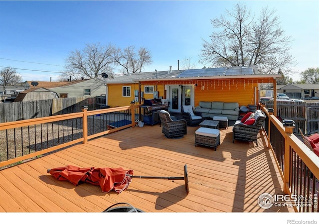 7970 Wolff Ct, Westminster, CO 80030 - deck with outdoor lounge area and a fenced backyard