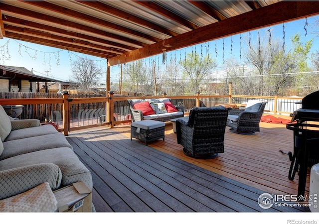 7970 Wolff Ct, Westminster, CO 80030 - wooden deck with outdoor lounge area and a grill