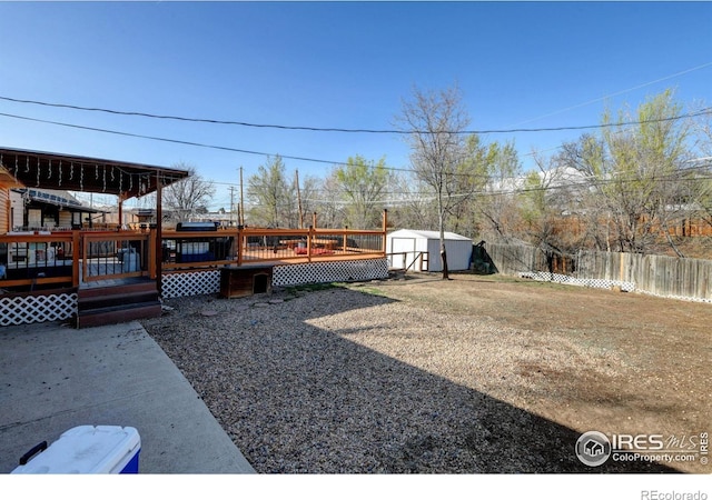 7970 Wolff Ct, Westminster, CO 80030 - view of yard featuring a storage unit and a deck