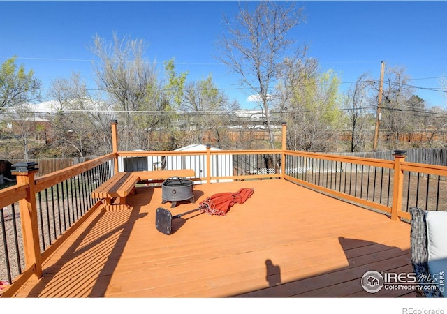 7970 Wolff Ct, Westminster, CO 80030 - wooden terrace with an outdoor fire pit