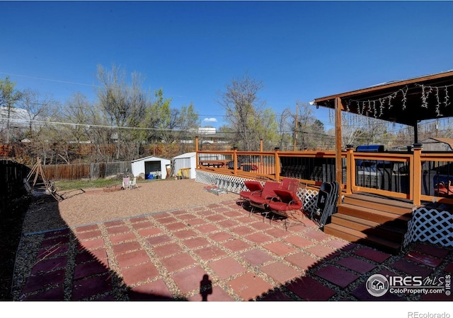 7970 Wolff Ct, Westminster, CO 80030 - view of patio featuring a storage shed and a wooden deck