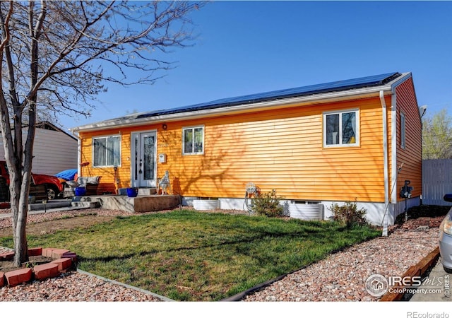 7970 Wolff Ct, Westminster, CO 80030 - view of front of house with roof mounted solar panels and a front yard