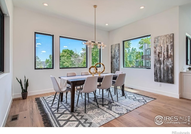 1126 W Enclave Cir, Louisville, CO 80027 - dining area with a chandelier, light wood finished floors, and recessed lighting