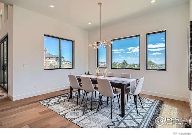 1126 W Enclave Cir, Louisville, CO 80027 - dining space with recessed lighting, light wood-style flooring, and a chandelier