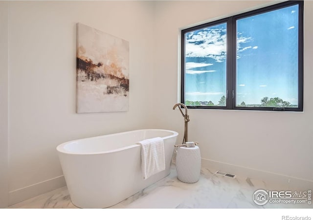 1126 W Enclave Cir, Louisville, CO 80027 - full bath featuring marble finish floors and a freestanding tub