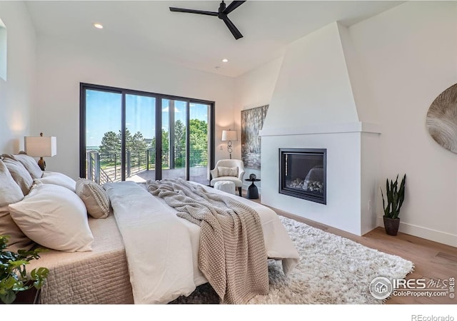 1126 W Enclave Cir, Louisville, CO 80027 - bedroom with access to exterior, a fireplace, wood finished floors, recessed lighting, and ceiling fan