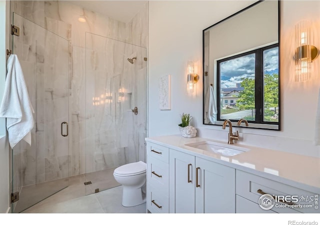 1126 W Enclave Cir, Louisville, CO 80027 - bathroom featuring a marble finish shower, vanity, and tile patterned floors