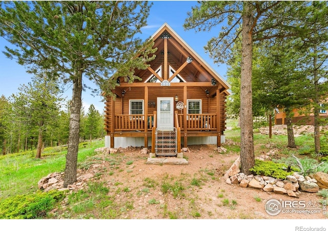 90 Woccon Ct, Red Feather Lakes, CO 80545 - log cabin featuring log siding and a porch