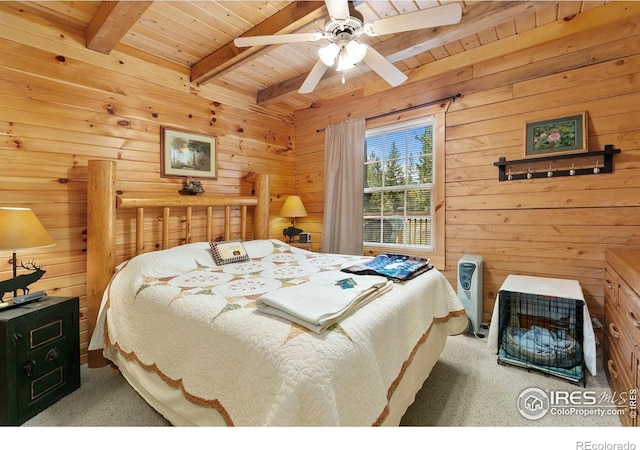 90 Woccon Ct, Red Feather Lakes, CO 80545 - bedroom with a wood ceiling with exposed beams, carpet floors, wooden walls, and ceiling fan