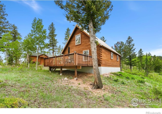 90 Woccon Ct, Red Feather Lakes, CO 80545 - rear view of property with a deck and log siding