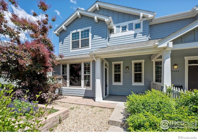 9273 W 107th Pl, Broomfield, CO 80021 - view of front of home featuring board and batten siding and covered porch