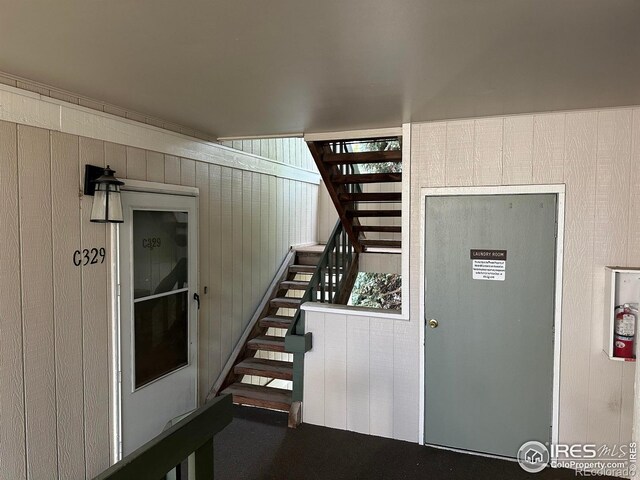 512 E Monroe Dr Unit 329, Fort Collins, CO 80525 - staircase featuring wooden walls