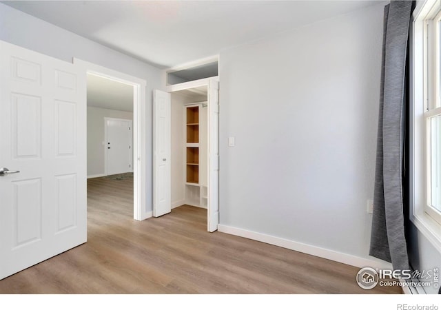 512 E Monroe Dr Unit 329, Fort Collins, CO 80525 - empty room with light wood-style floors and baseboards