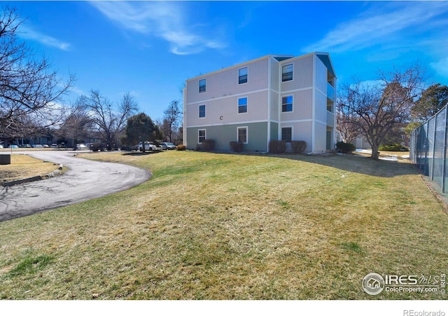 512 E Monroe Dr Unit 329, Fort Collins, CO 80525 - back of property featuring a yard