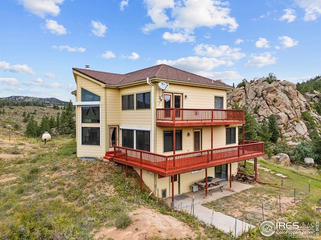 366 N Rim Rd, Livermore, CO 80536 - rear view of house with a patio and a deck
