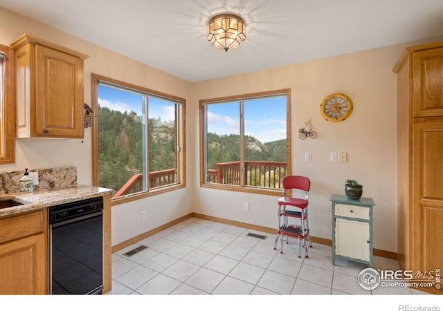 366 N Rim Rd, Livermore, CO 80536 - kitchen featuring light tile patterned floors, light stone countertops, and dishwasher