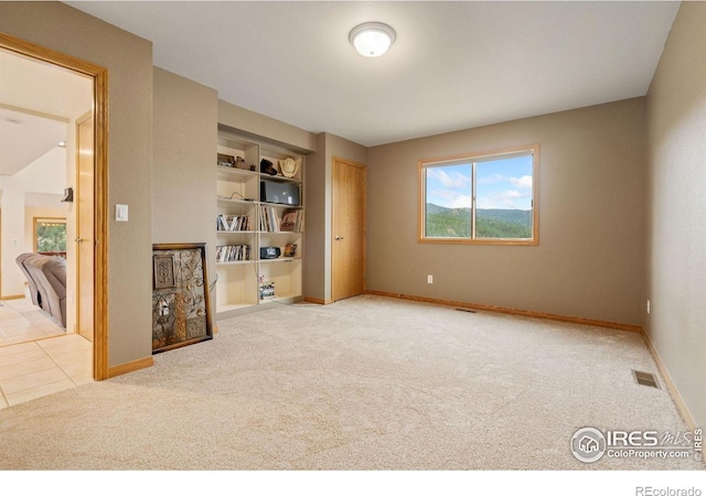 366 N Rim Rd, Livermore, CO 80536 - unfurnished room with carpet flooring and built in shelves